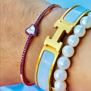 Diamond and ruby customed bracelet and Hermès Clic